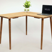 An 'L' shaped simple corner desk with a laptop on top, displayed in medium oak wood color, alongside color swatches indicating available wood tones.