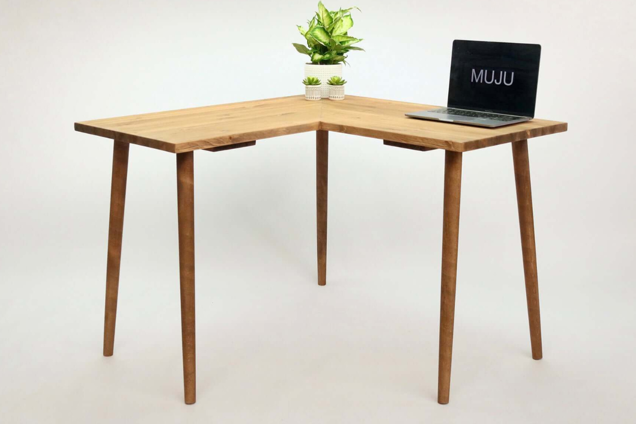 An 'L' shaped simple corner desk with a laptop on top, displayed in medium oak wood color, alongside color swatches indicating available wood tones.